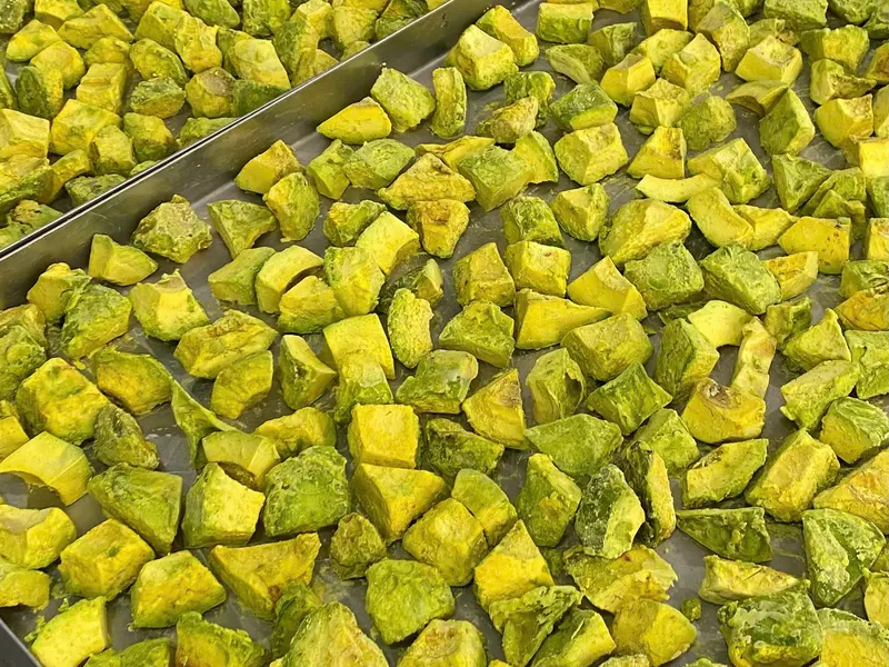 Freeze-dried Vietnamese fruit mix on a production tray, KHAMACO
