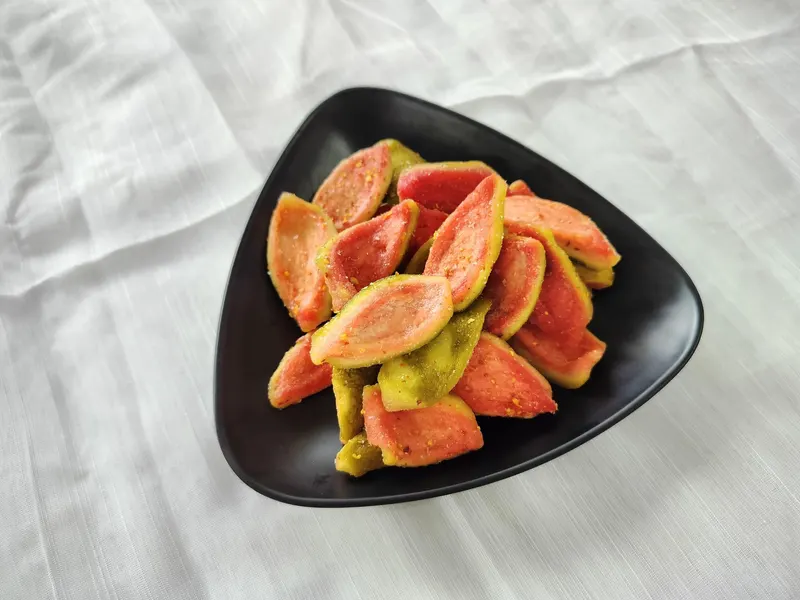 Soft-dried guava slices in a black bowl, KHAMACO Vietnam