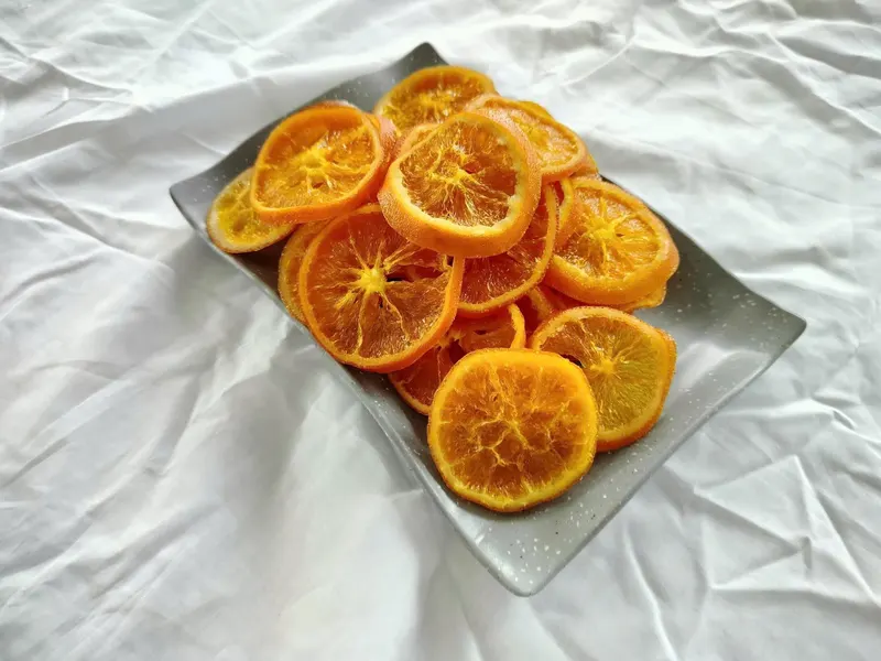 Soft-dried orange wheels on a serving plate, KHAMACO Vietnam