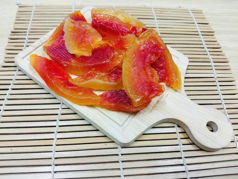 Soft-dried papaya slices on a drying rack, KHAMACO Vietnam