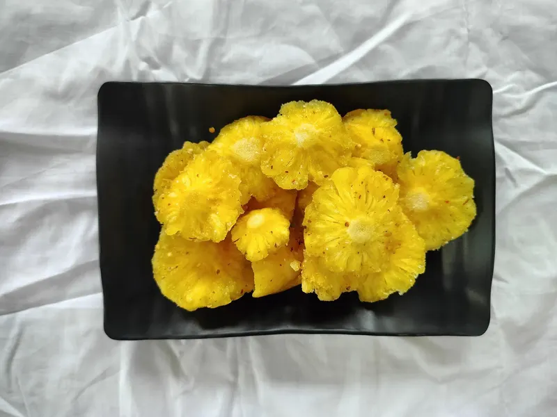 Soft-dried pineapple pieces on a serving tray, KHAMACO Vietnam
