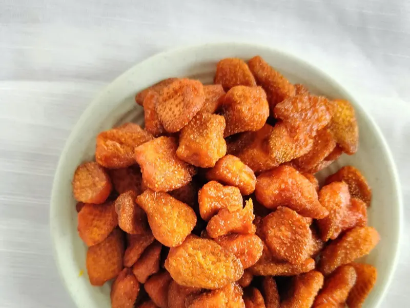 Soft-dried strawberry pieces in a white bowl, KHAMACO Vietnam