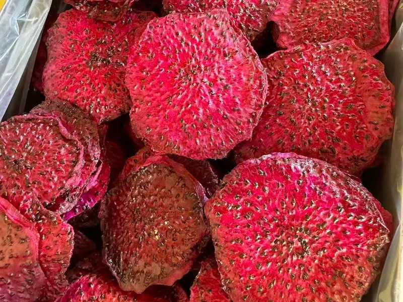 Soft-dried red dragon fruit slices packed in a plastic-lined tray